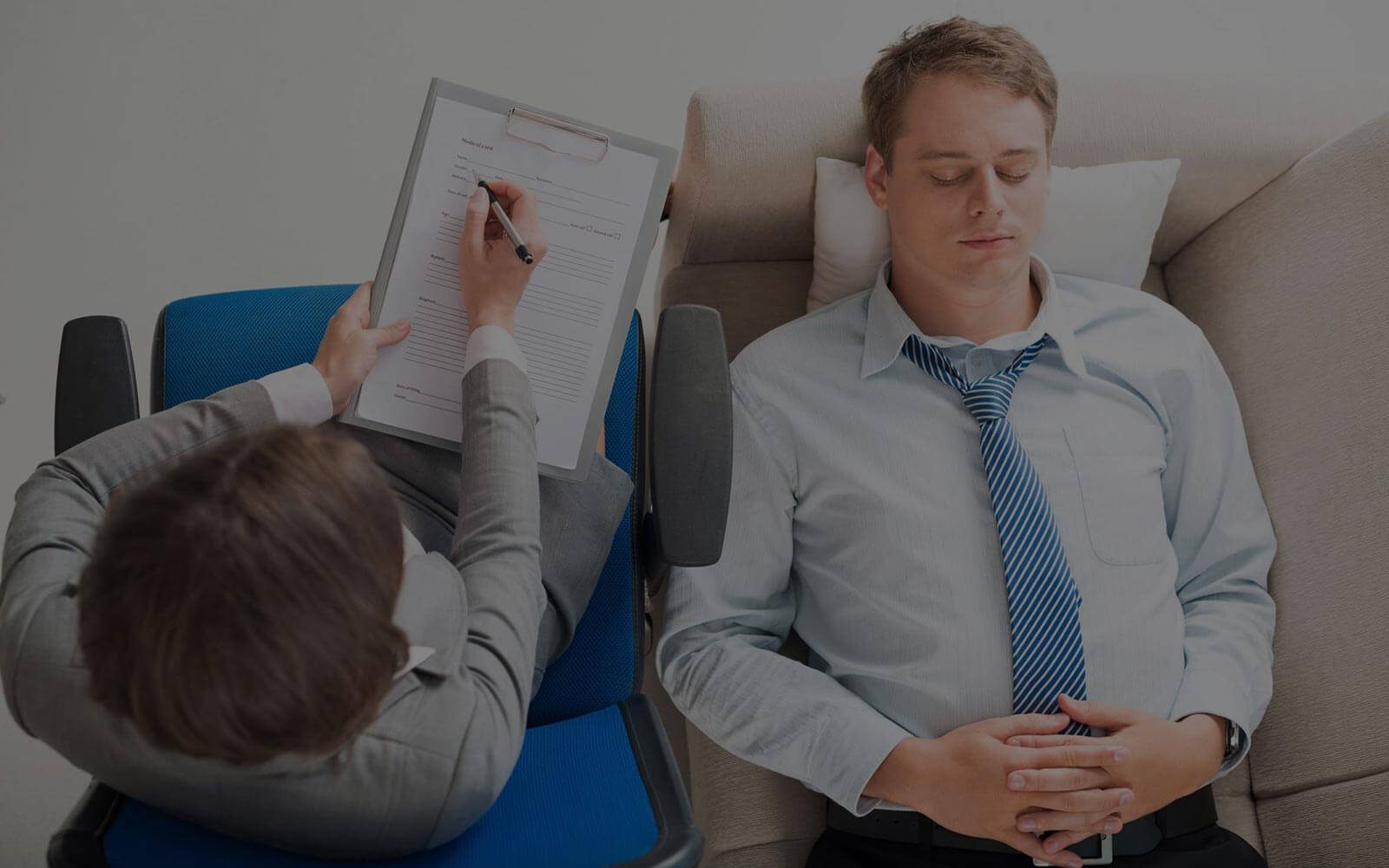 Man Lying On Sofa Having Therapy