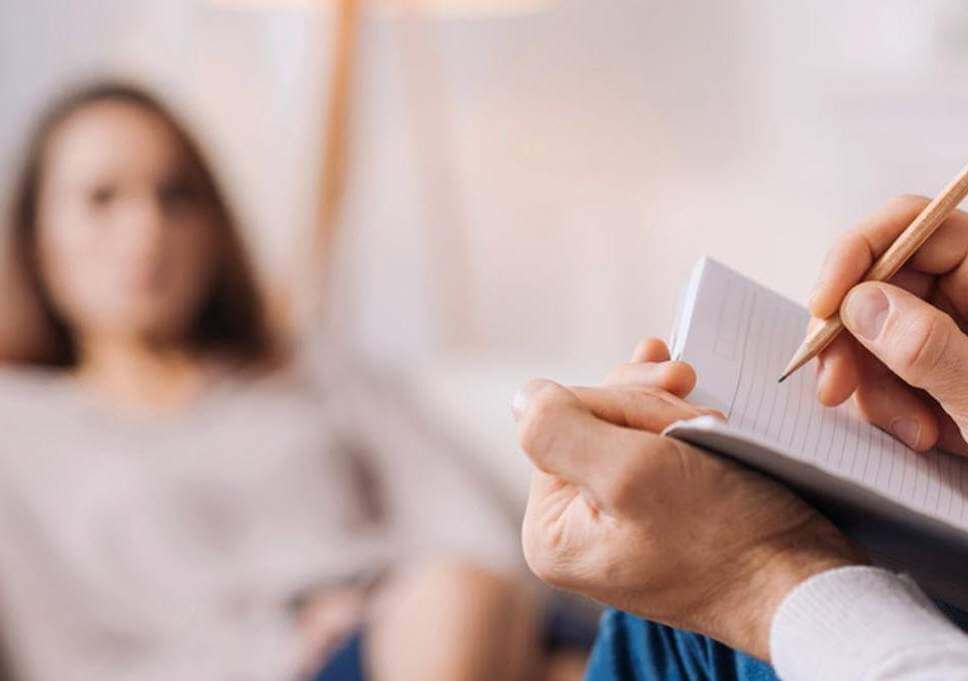 Blurry Image Of Woman Listening To Counsellor