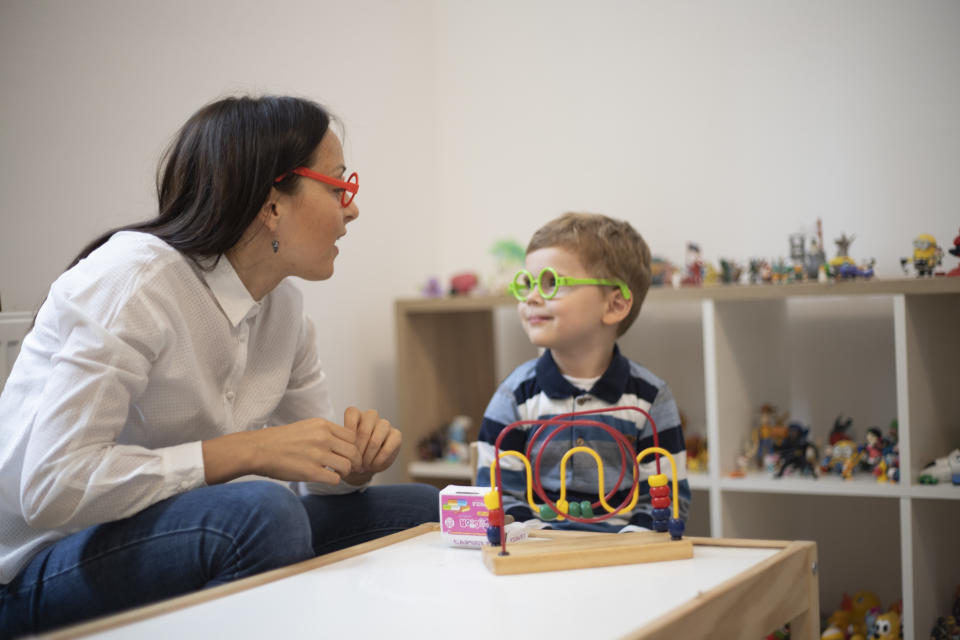 child psychologist playing with young boy