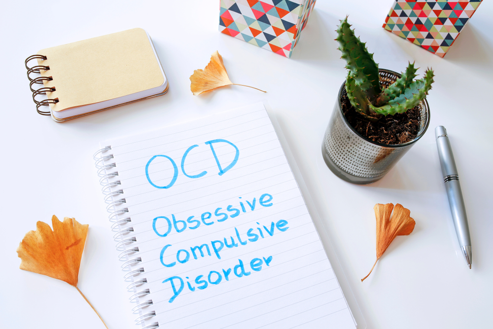 OCD Obsessive Compulsive Disorder Written In Notebook On White Table