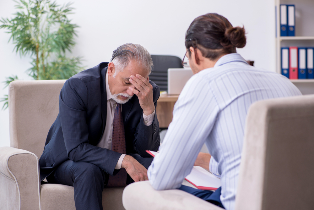 man suffering with depression having counselling