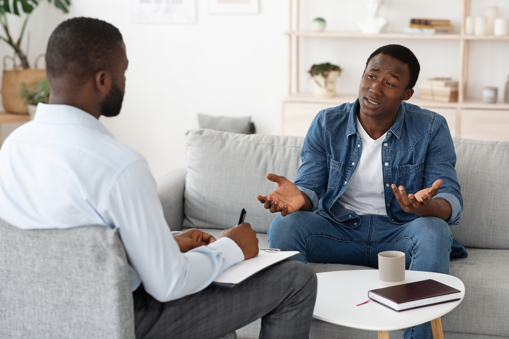 man receiving private counselling from male counsellor