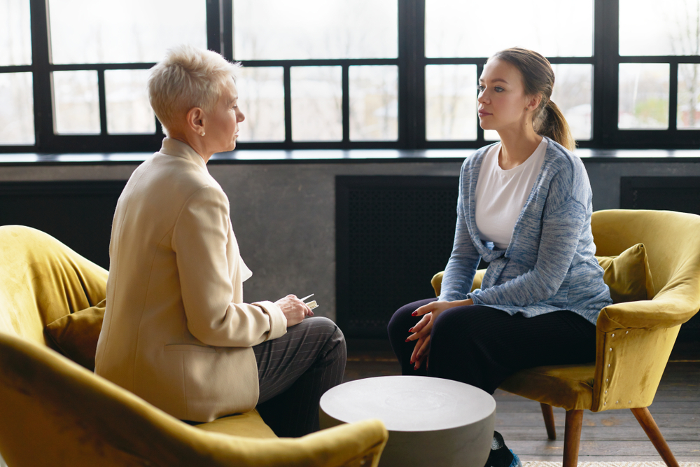 woman having stress counselling with counsellor