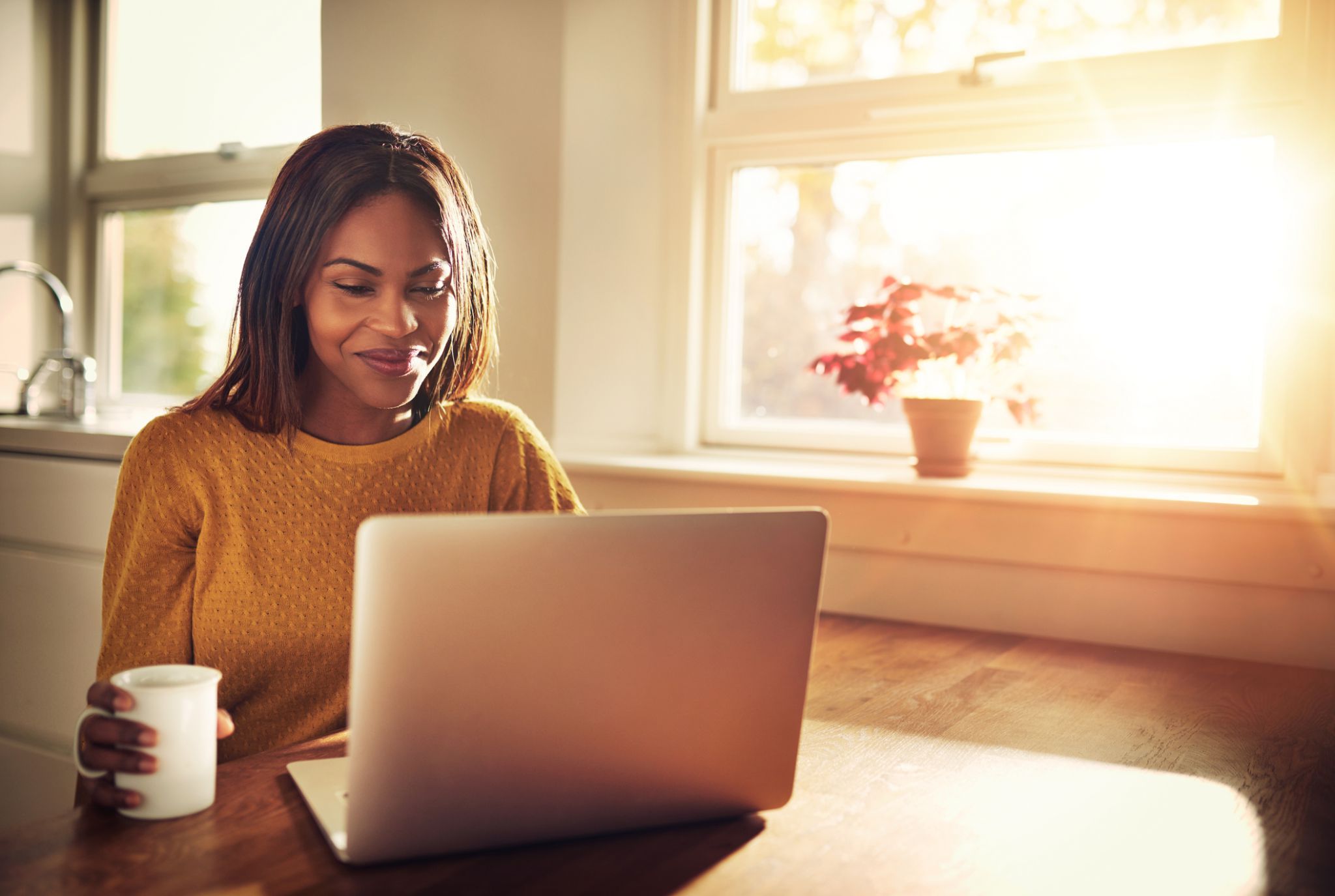 smiling woman during online therapy session