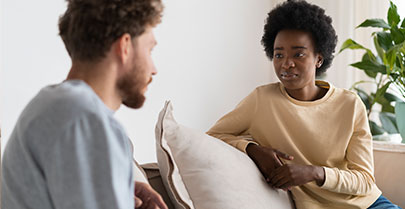 couple talking on sofa