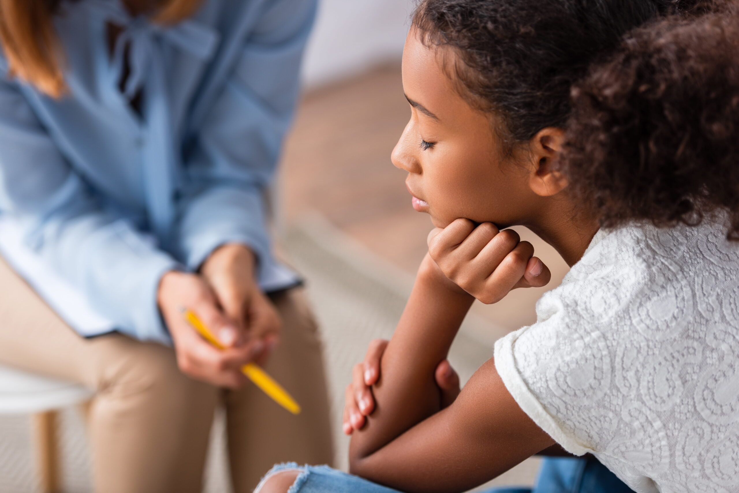 young girl struggling with low mood in counselling session